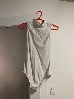 Sleeveless High Neck White Bodysuit